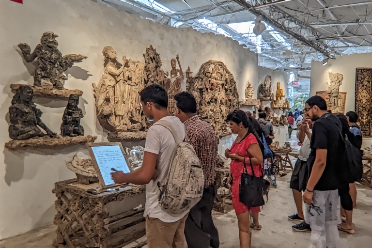 Tourists exploring the cultural artifacts at Heritage Village Abu Dhabi